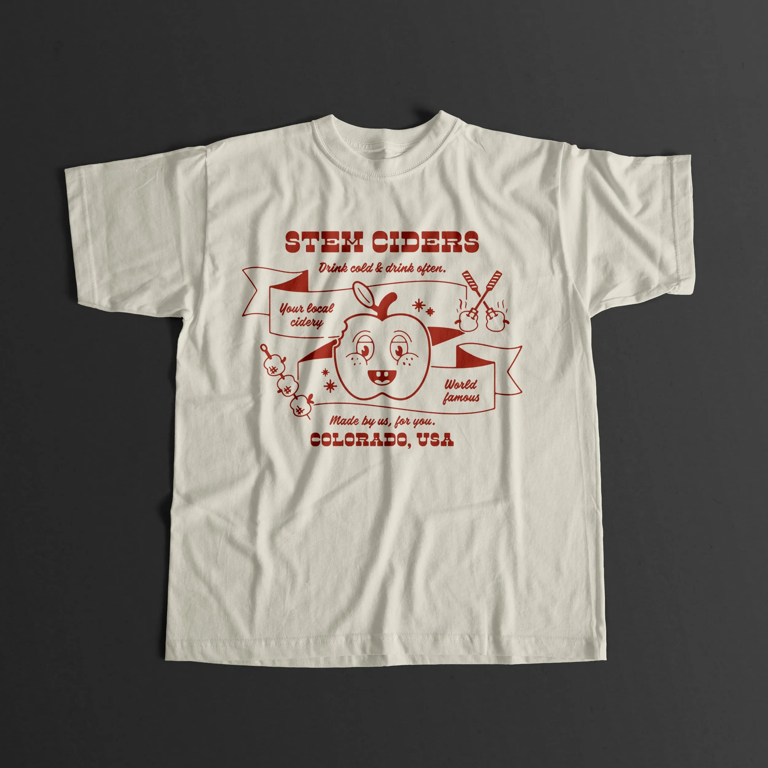 Cream t-shirt with a red Stem Ciders apple BBQ illustration