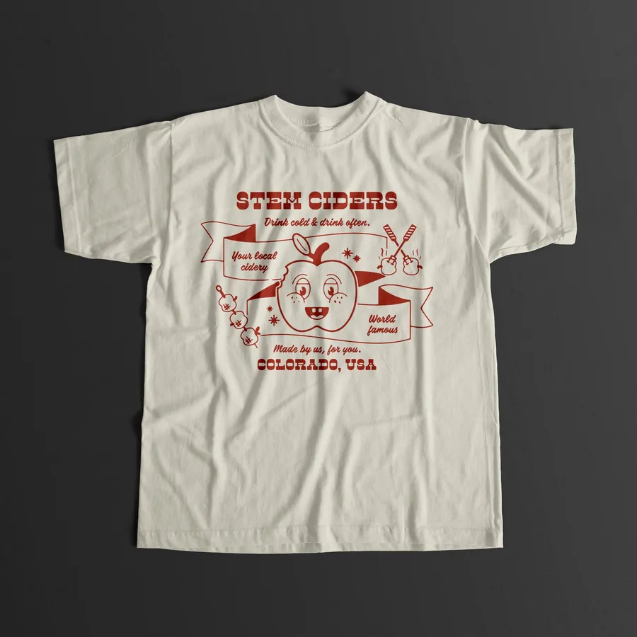 Cream t-shirt with a red Stem Ciders apple BBQ illustration