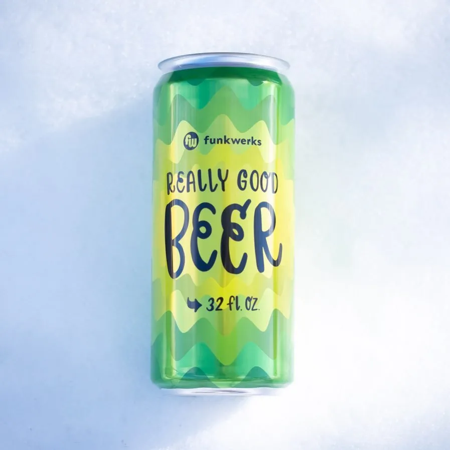 'Really Good Beer' 32 oz crowler can against a bright sky