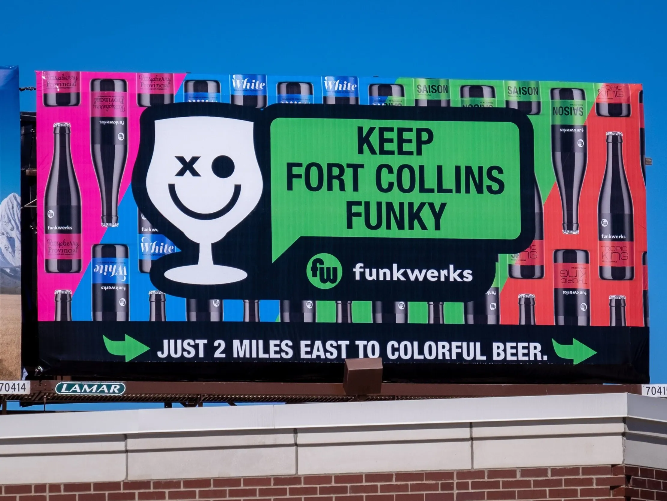 'Keep Fort Collins Funky' billboard with the colorful can pattern