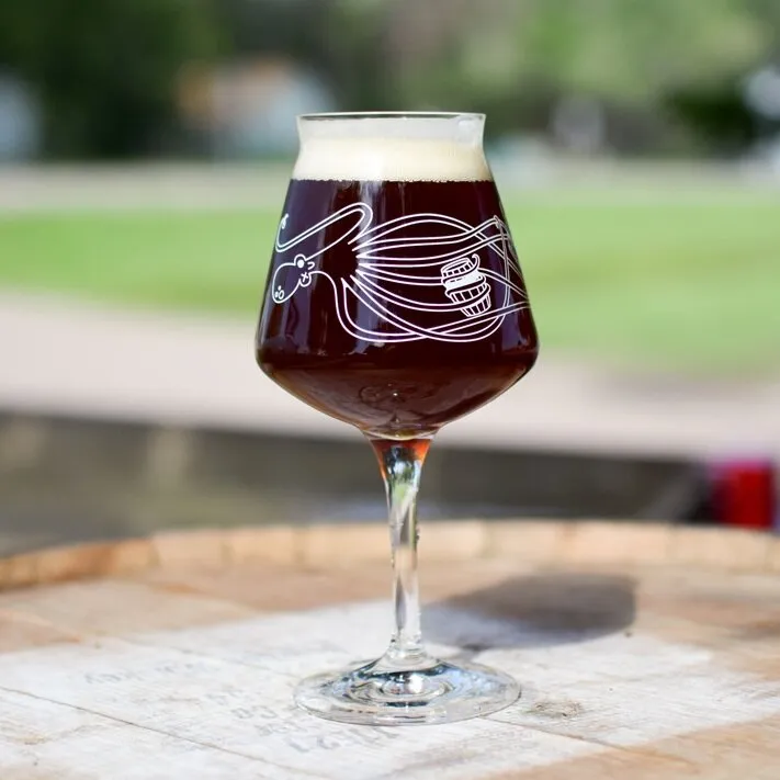 Tulip glass with an octopus illustration on a barrel