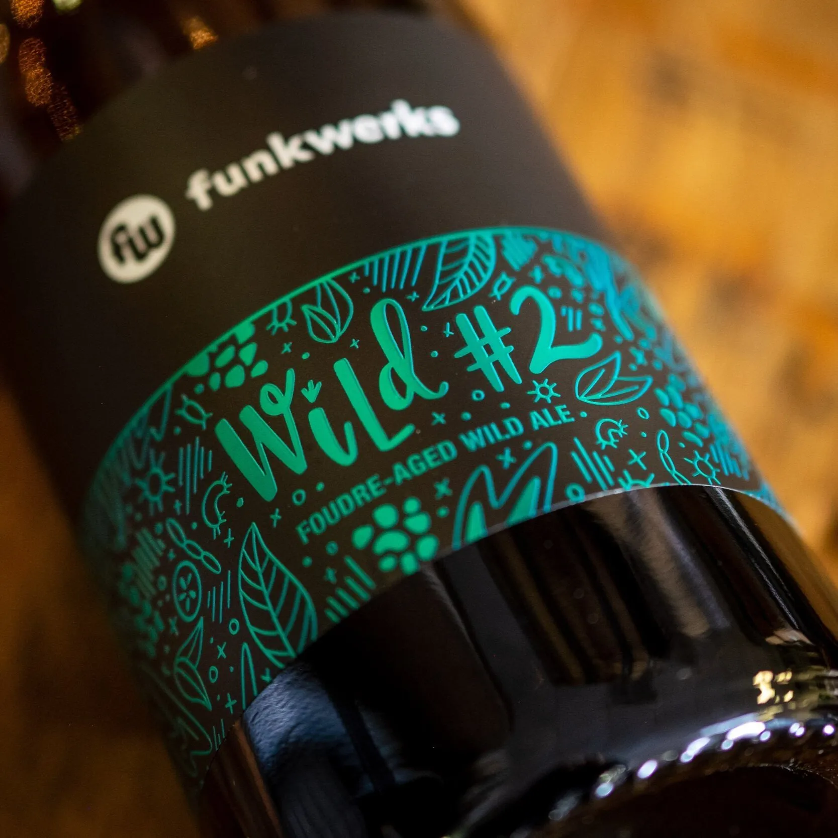 Wild #2 bottle with teal botanical label