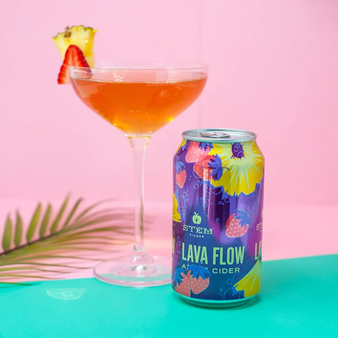 Lava Flow can beside a coupe cocktail on pink and teal